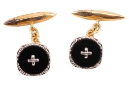 A pair of 18ct gold cufflinks, each cufflink featuring a circular onyx plaque fixed with a central w