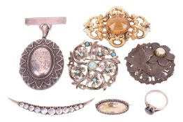A collection of jewellery items including a moonstone crescent brooch, a citrine-set gilt brooch, a 
