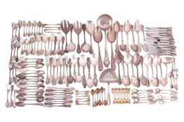 A large quantity of continental flatware and cutlery, comprising a soup ladle, sauce ladle, serving 