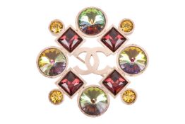 A Chanel brooch, circa Autumn 2006, featuring paste gemstones in yellow, green and purple, with inte