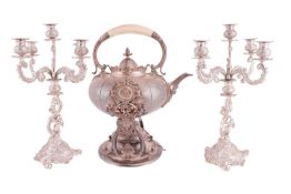 A 19th century Continental silver plated kettle on stand, of large proportions and profusely decorat