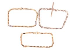 Three bracelets, all marked '375', comprising a curb chain with a T-bar, a cubic-link bracelet and a