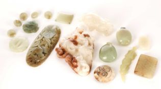 A collection of Chinese jades, comprising a white and russet carving of two chilong, a white jade pr