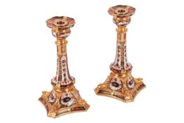 A pair of Royal Crown Derby candlesticks, in the 1128 Old Imari pattern, 27 cm high.Qty: 2Cracks to 