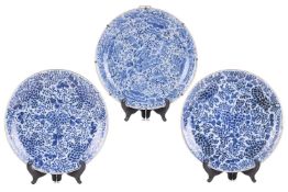 Three large Chinese blue & white dished chargers, Qing, Kangxi period, each painted with blossom