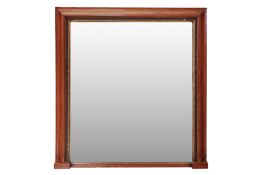 A Victorian over-mantel mirror with a satinwood ogee molded frame and meandering oak leaf and acorn 