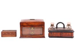A Victorian figured walnut jewellery box with cushion form cover, with inset bale handle opening to 