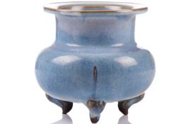 A Chinese Jun style censer, with flattened everted rim above a baluster body, supported on three inc
