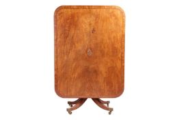 A George IV mahogany rectangular breakfast table with banded top and moulded edge on a quadrupartite
