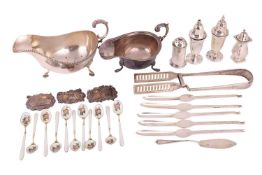 Two silver sauce boats each with flying scroll handles and three hoof feet, together with a set of e