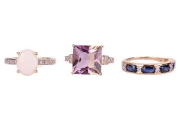 Three gem-set dress rings in 9ct gold; to include an opal oval cabochon claw-set between diamond sho
