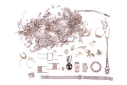 A collection of jewellery mounts and broken jewellery items, the majority testing as 9ct gold and pl