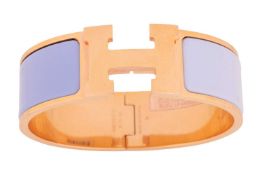 Hermès - A wide 'Clic H' bracelet with 'blue lavender' enamel and gold-tone metal, signed and marked