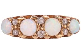 An opal and diamond half hoop ring, consisting of four graduated opal cabochons, flanked by eight ro