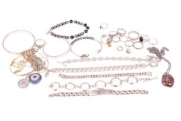 A collection of jewellery items including four bangles, a curb link identity bracelet, marked '925',