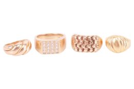A collection of four rings; comprising a 9ct gold ring of reeded and woven design, size Vl a ring of