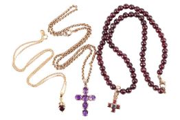 Three gem-set necklaces; to include a cross pendant composed of oval-cut amethysts in 9ct gold mount
