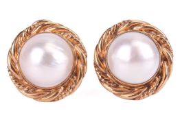 A pair of mabé pearl clip-on earrings in 9ct yellow gold, each centred with a round mabé pearl of 12