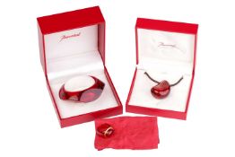 Baccarat - a red 'Galet' pendant on cord, a red 'Galet' open cuff bangle, and a red 'Médicis' dome r