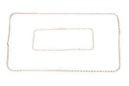 Two chains, the first a 9ct yellow gold chain with round belcher links to a lobster clasp, measuring