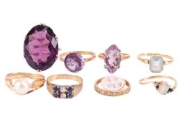 Eight gem-set rings including a paste-set cocktail ring, in yellow metal marked '9ct', a synthetic c