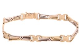 A fancy link bracelet, composed of pierced links and completed with a box clasp and safety catch, bi