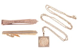 A 9ct gold plaque pendant, the square pendant depicting a sunburst design, to a yellow metal chain m