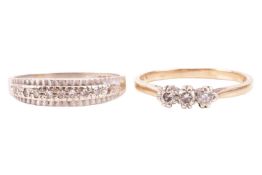 A three-stone diamond ring, claw-set with round brilliant diamonds, in a 9ct gold mount, size S1/4; 