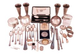 A set of four George III silver spill vases, London 1802, a pair of silver plated soup ladles, a sil