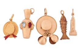 A collection of five charms; including two hats, a fish, a paste-set urn and the Chrysler building, 