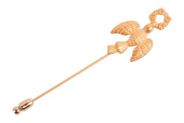 A dove and wreath stick pin, by Annick Goutal, in gold-plated metal, measuring approximately 8.4cm l