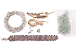 A collection of costume jewellery: consisting two brooches, a bracelet formed of San Marino 2 centes