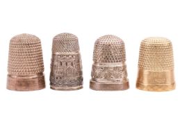 Four thimbles; one bearing the initials 'L.O.C.W' in yellow metal marked '10k', 4 grams; and three o