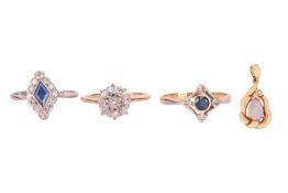 Three gem-set rings and a pendant; including a diamond-set cluster ring, claw-set with nine old-cut 