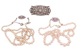 Two cultured pearl necklaces and a brooch set with paste; the first necklace with graduated pearls f