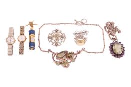 A Scottish silver brooch of Celtic design, set with a large citrine, 4.5 cm wide; a large citrine an