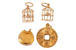 A collection of pendants, including a Chinese 'Happy Birthday' charm in the form of qian, in yellow 