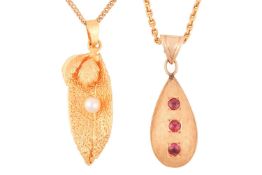 A gem-set drop pendant, the brushed pear-shaped drop set three rubies, in a yellow metal mount marke