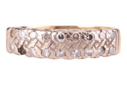 A diamond-set dress ring in 18ct gold, set with two rows of single-cut diamonds, one stone missing, 