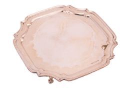 A shaped square silver salver on four scroll feet, 26.5cm x 26.5cm, Sheffield 1959, Viner's Ltd (Emi