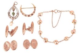 An Edwardian pendant set with split pearl, paste and suspending a pearl drop, in mount marked '9ct';