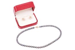 A Tahitian cultured pearl necklace and a pair of pearl and diamond stud earrings; the necklace compr