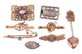 A collection of jewellery items including a gem-set Victorian Etruscan revival brooch, marked '9ct',