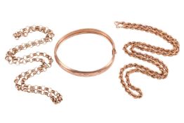 A 9ct gold hinged bangle, the domed bangle featuring floral and foliate bright-cut engraving, the in