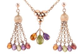A multi-gem set pendant and earring suite, the pendant claw-set with three pear-shaped gemstones inc