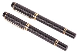 A pair of Waterman Le Man 100 Opera fountain pens, of black barrels with engraved patterns and gold-