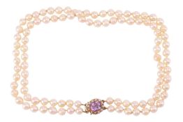 A double-strand cultured pearl necklace, the pearls of cream body with green overtones, measuring ap