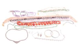 A group lot of jewellery, to include beaded necklaces of amber, coral, quartz, hematite, cultured pe