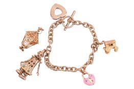 A 9ct gold charm bracelet, with five charms, one detached, including an enamel heart padlock, a stag