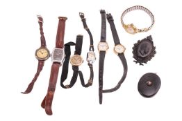 A small group of items comprising seven wristwatches, one in a yellow metal case marked '14K', toget